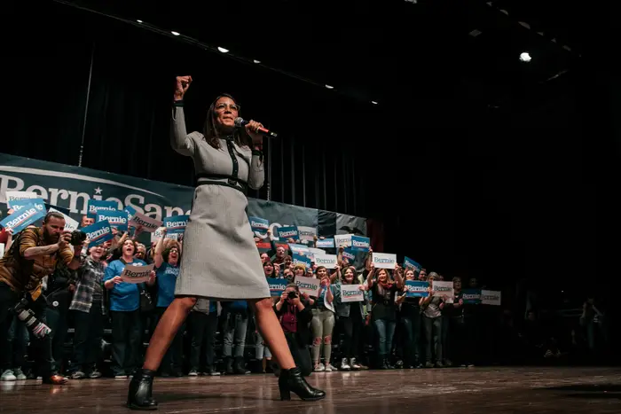 Rep. Alexandria Ocasio-Cortez greets the crowd at a rally for Bernie Sanders in Ames, Iowa, on January 25.